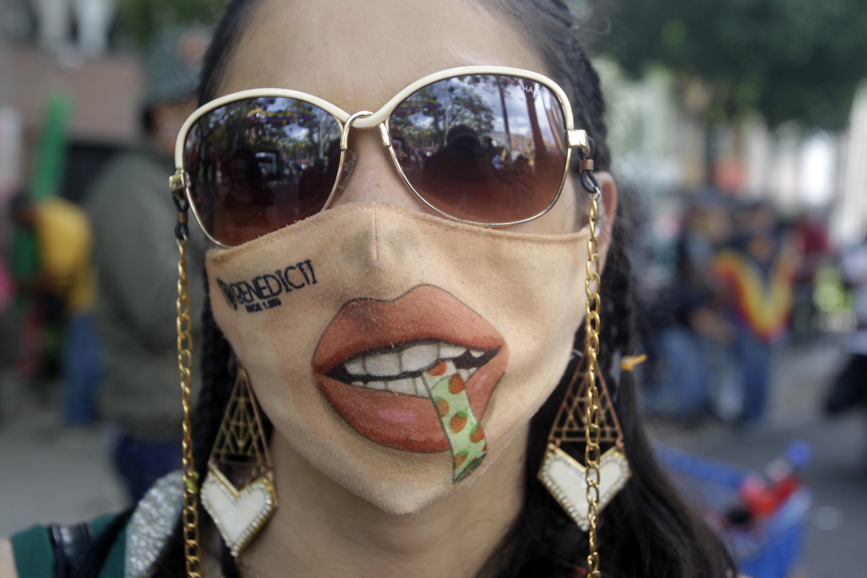 Colombian woman wears joint themed face mask.