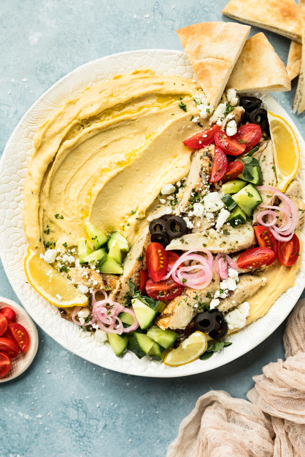 A chicken and vegetable hummus bowl.