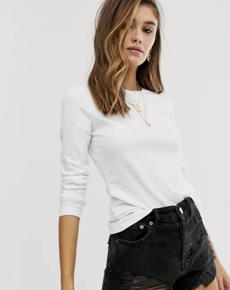 Model wearing white long-sleeve Asos shirt 