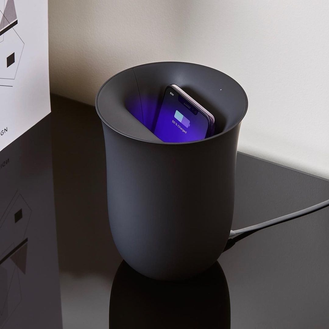 A phone inside the charging vase
