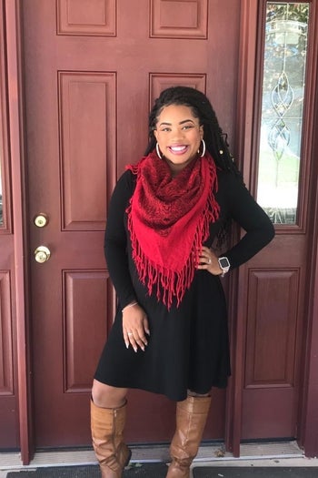 Reviewer wearing black T-shirt dress