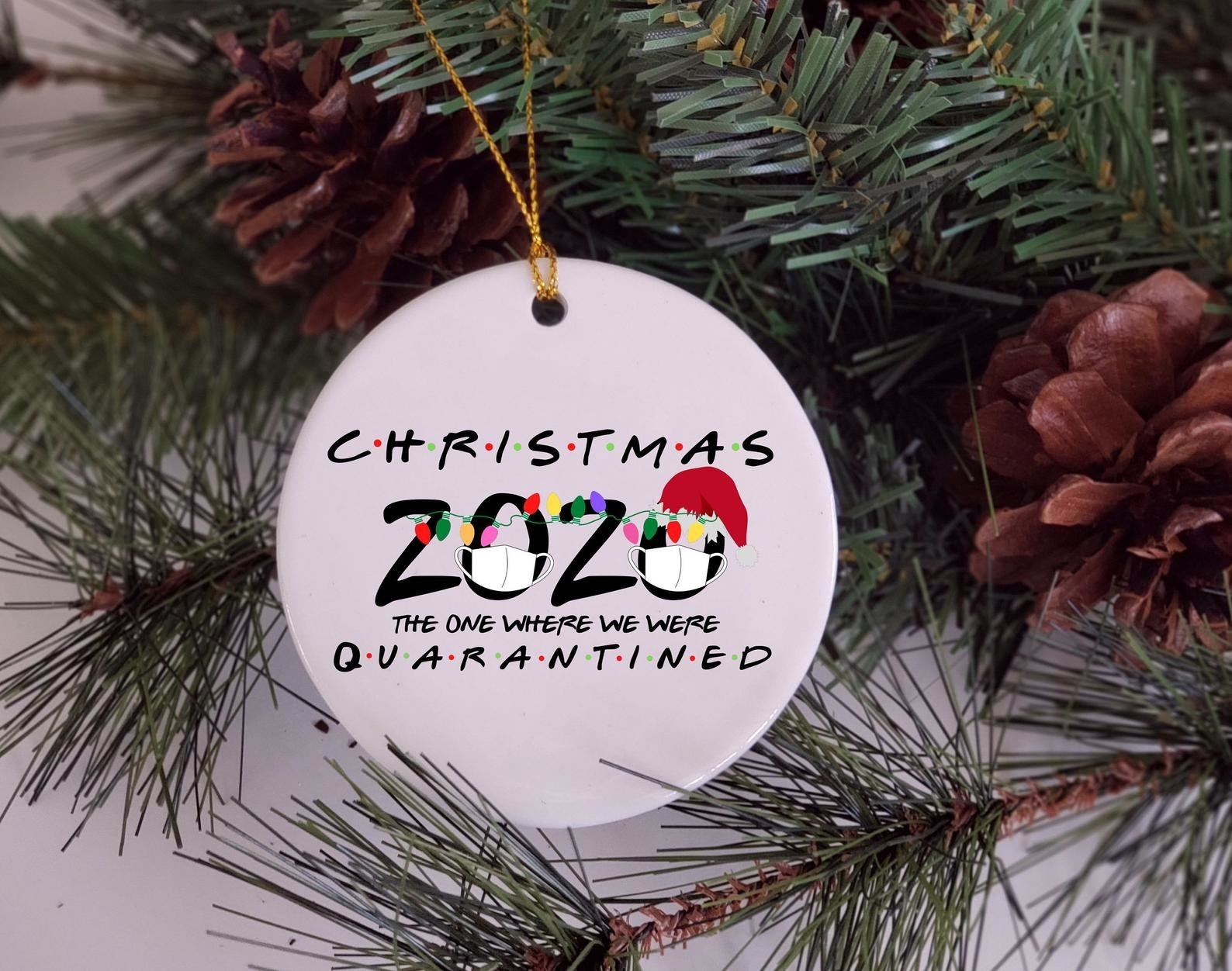 the ornament on a tree that says christmas 2020 the one where we all quarantined