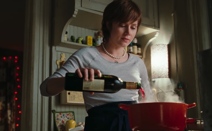 Julie from &quot;Julie &amp;amp; Julia&quot; pouring wine in a pot in her small kitchen