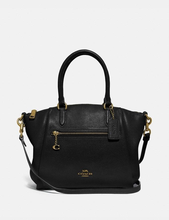a black satchel with gold accents and the coach logo