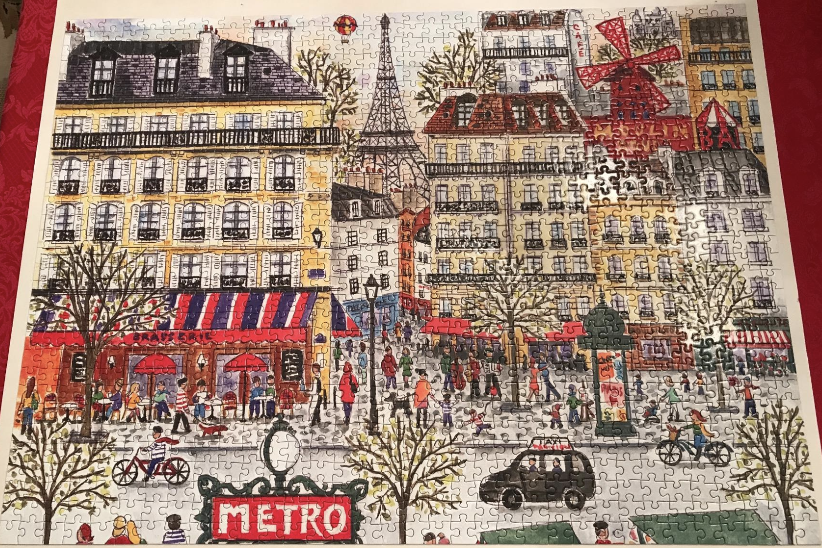 reviewer showing completed puzzle of Paris scene