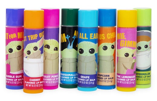 Eight lip balms in different colors with cartoon images of Baby Yoda on them