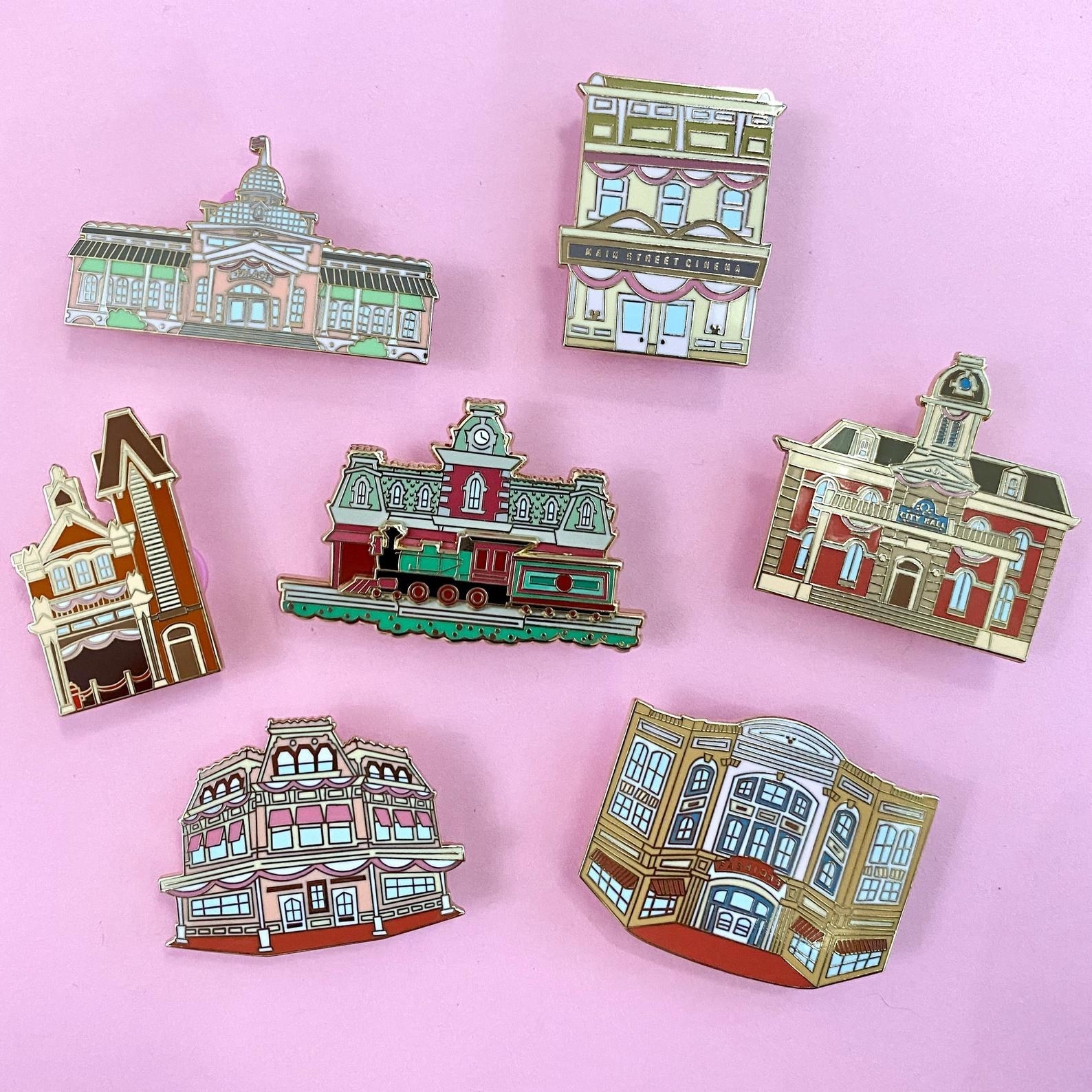 an array of disney world pins