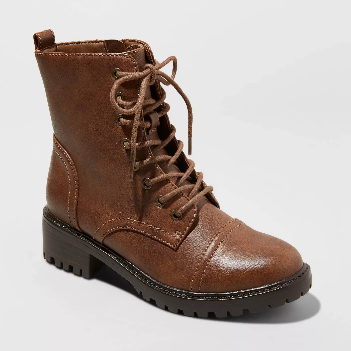 Short brown boots with laces. Sole is black.