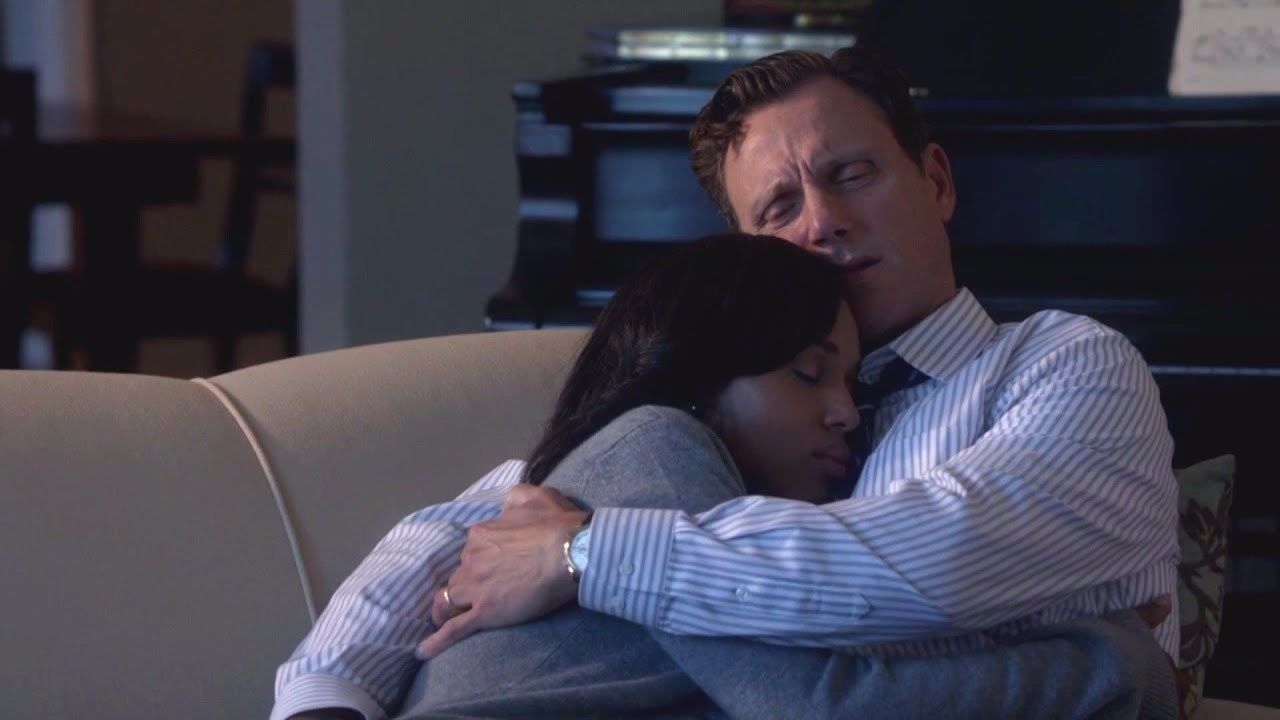 Fitz holding Olivia in his arms. 