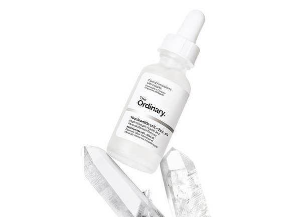 The dropper bottle of the serum — the serum itself is clear