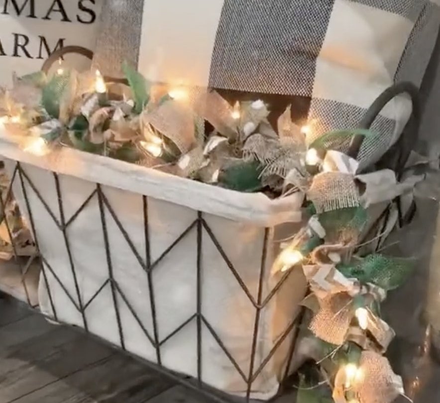 A basket filled with lights and bows