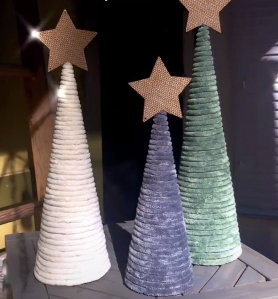 Triangular trees made from yarn with a star on top