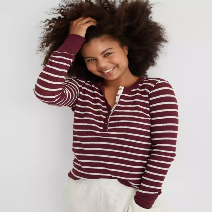 a model in a long sleeve striped top
