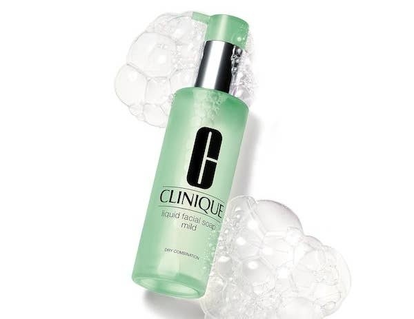 The liquid facial soap surrounded by some bubbles