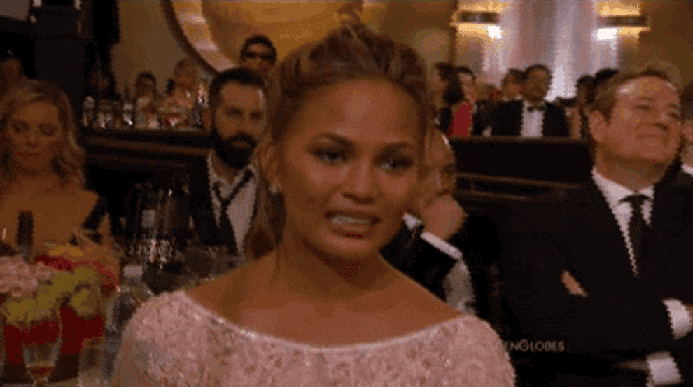 Chrissy Teigen gives her iconic cringe face at the &quot;Golden Globes&quot;
