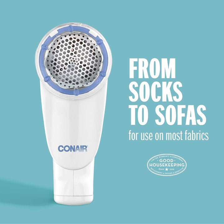The white Conair sweater shaver with text that reads "From socks to sofas, for use on most fabrics" with the Good Housekeeping seal 