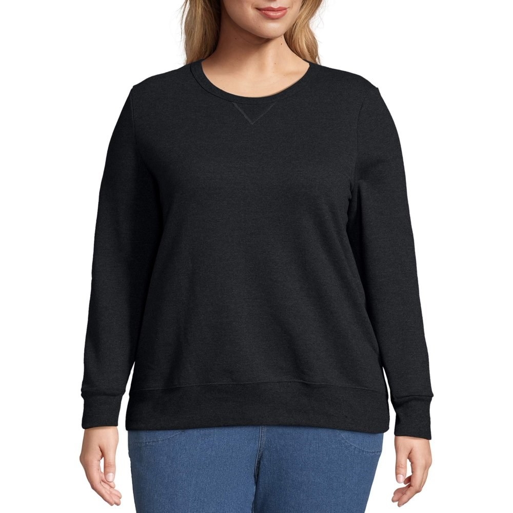 model wears plain  black sweatshirt 