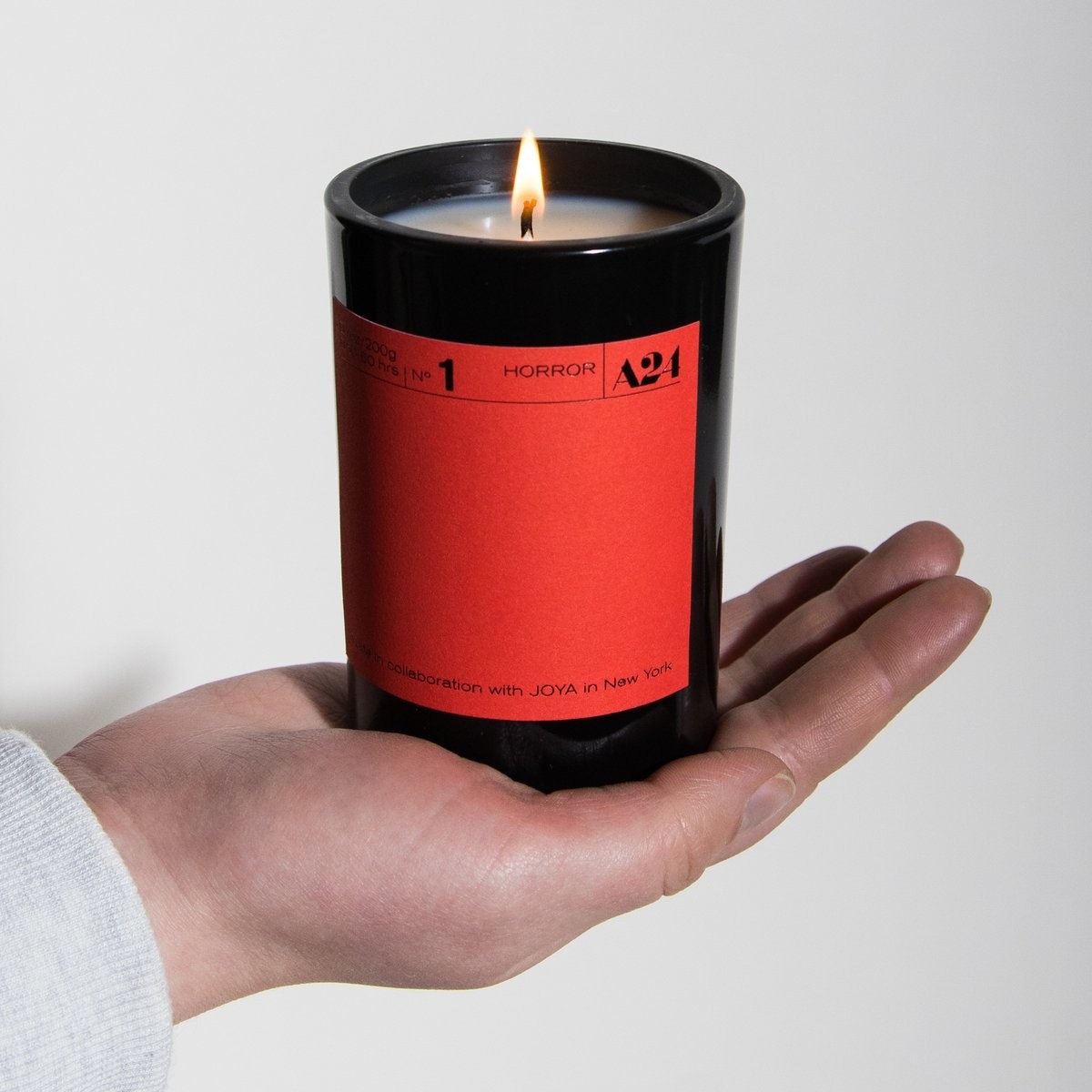 A hand holding the thriller candle