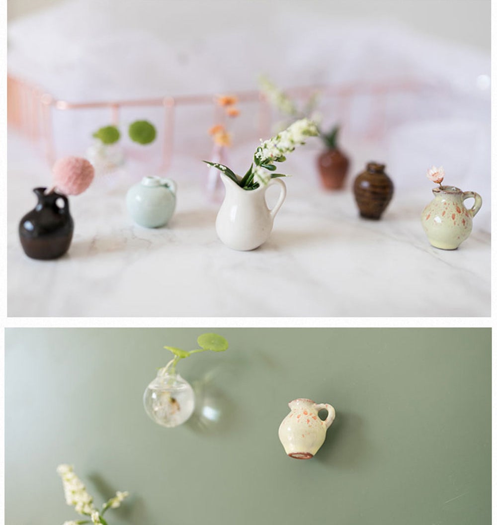 eight different tiny vases, some with plants inside of them 