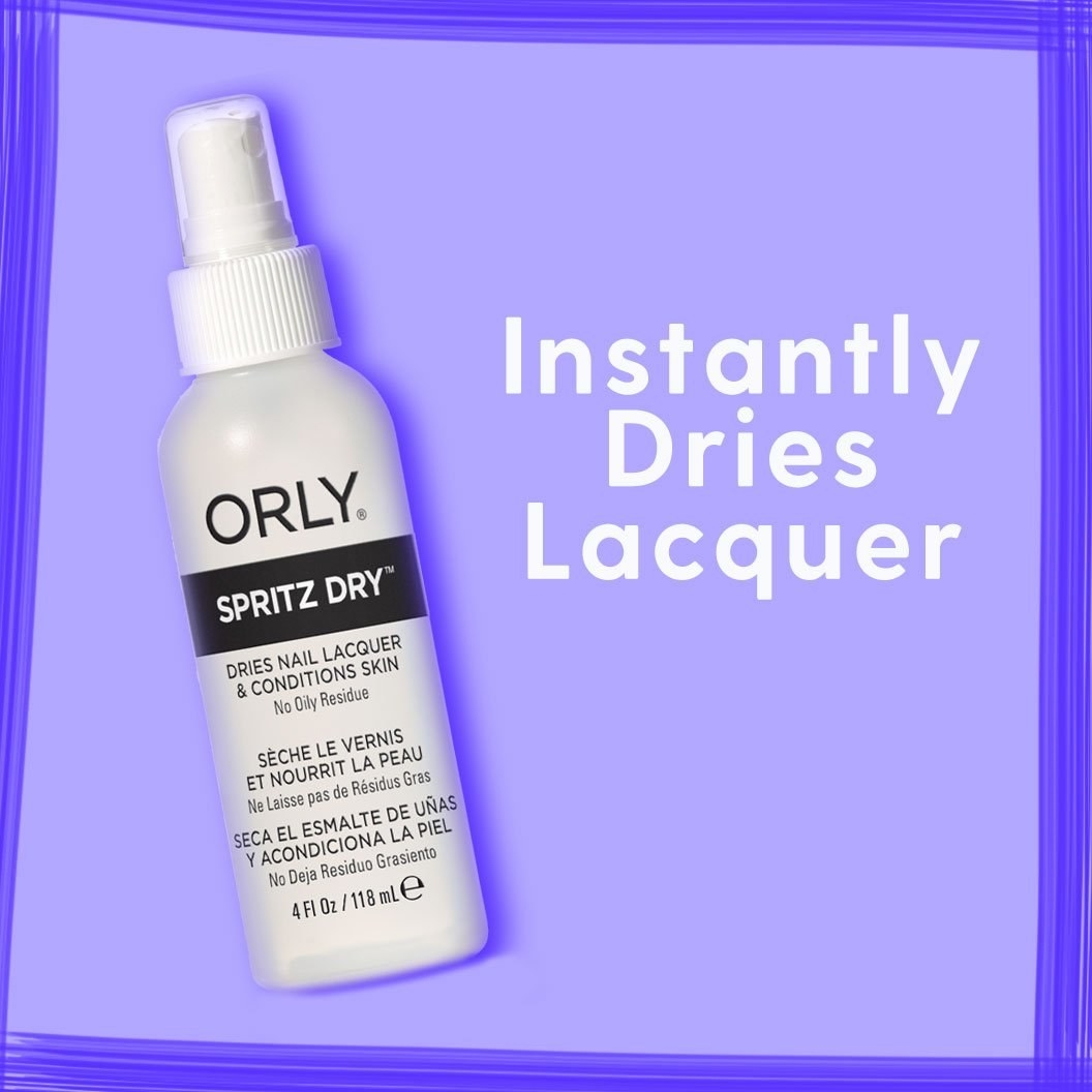 The spray bottle with text &quot;instantly dries laquer&quot;