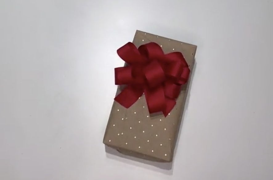 A small present with a large red bow