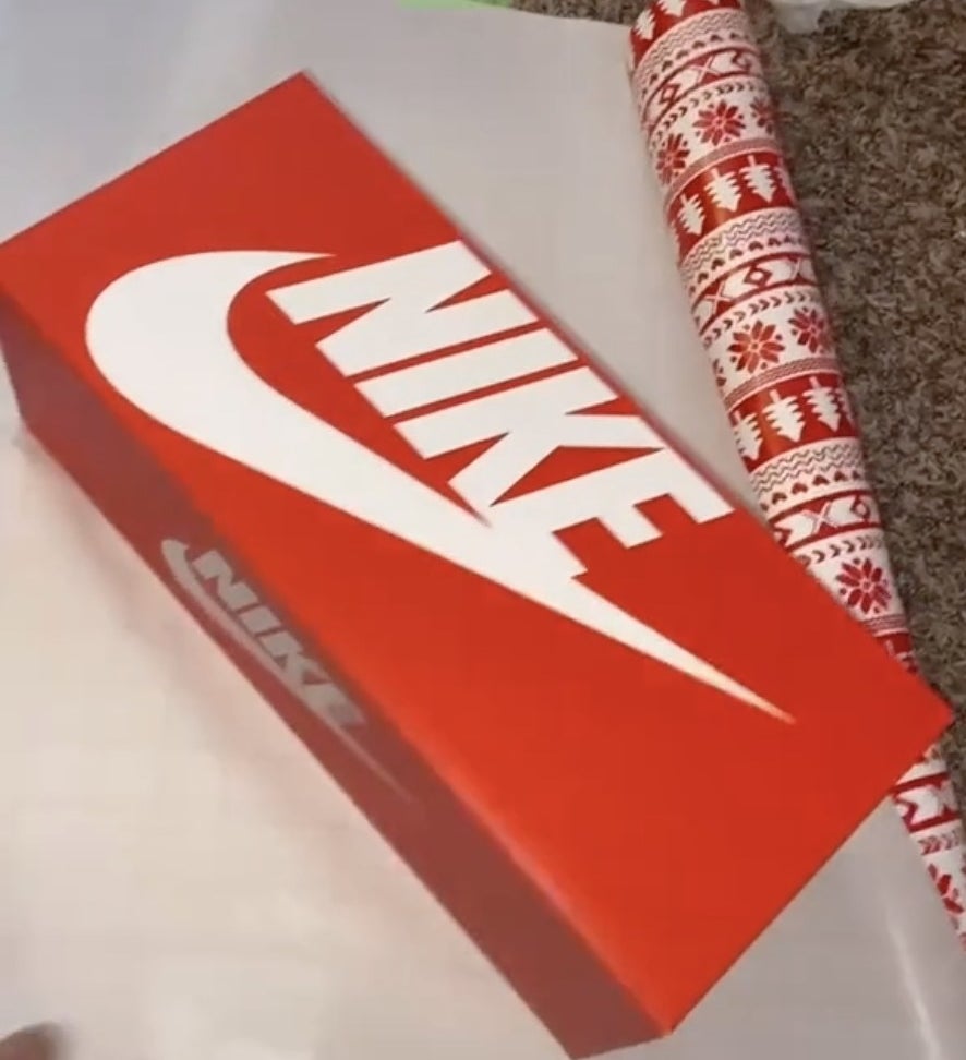 A Nike box on top of wrapping paper