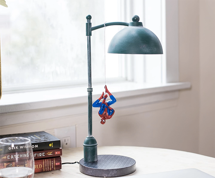 lamp that looks like a city streetlight with spiderman hanging from lamp 