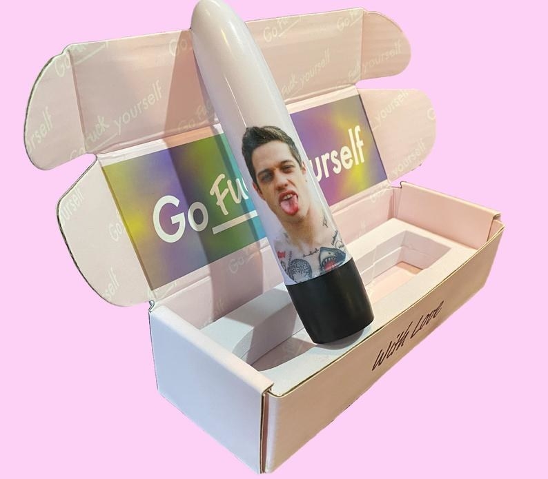 Side view of Pete Davidson vibrator inside of packaging