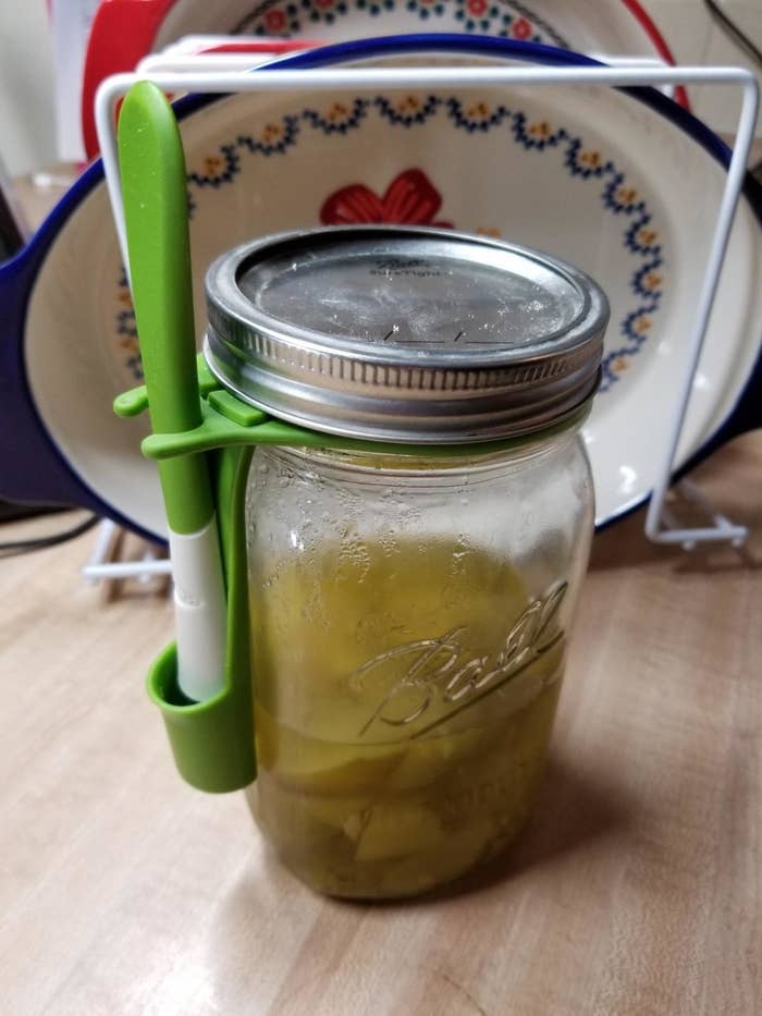 mason jar with holster and small fork in it 