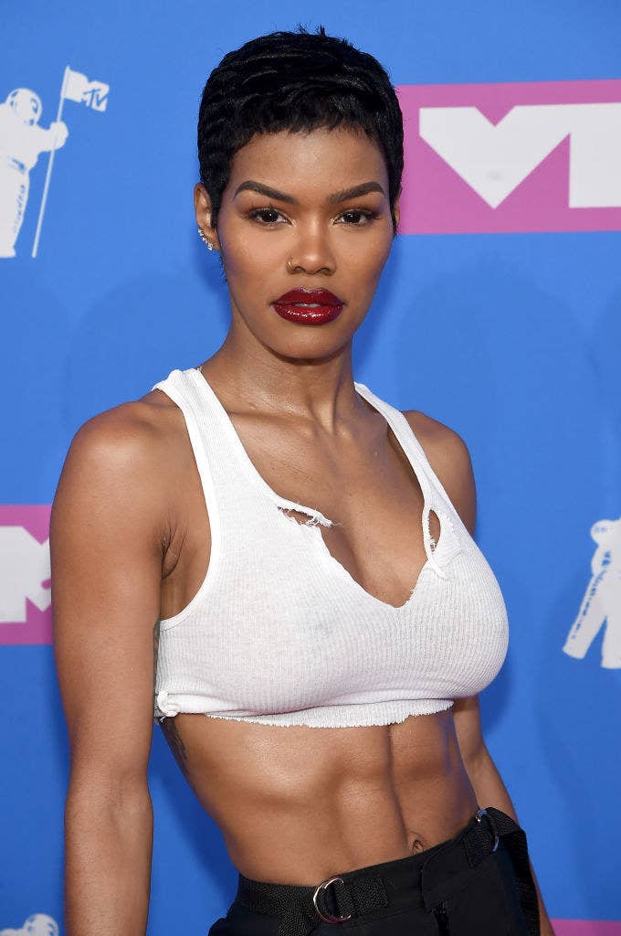 Teyana in a bright lipstick and crop top