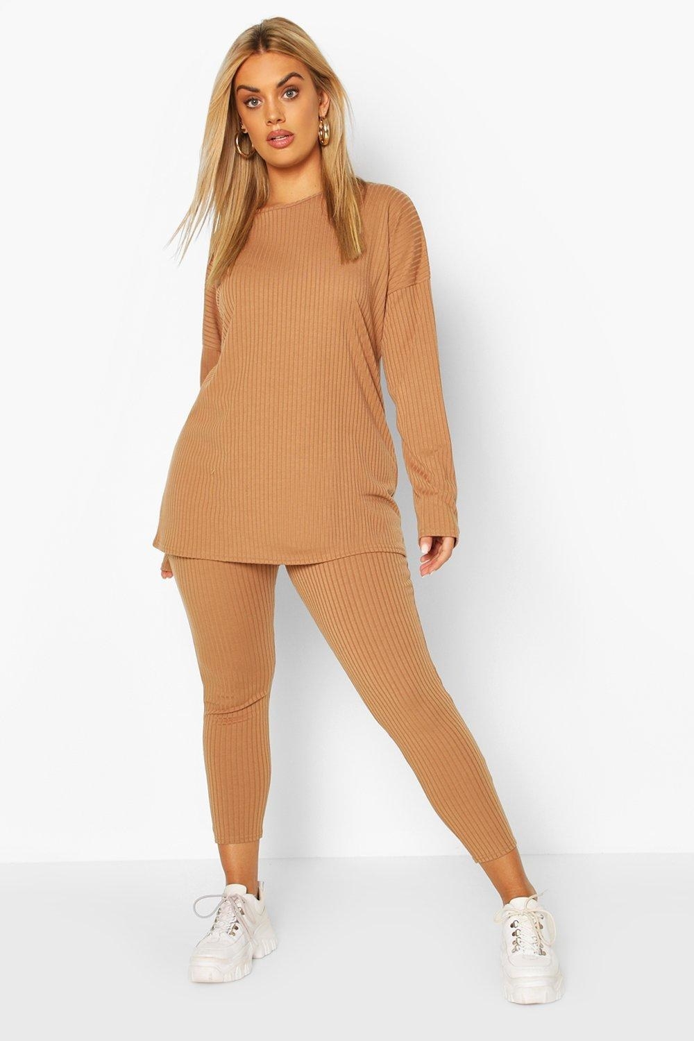 plus size model wearing camel loose top and leggings in ribbed fabric