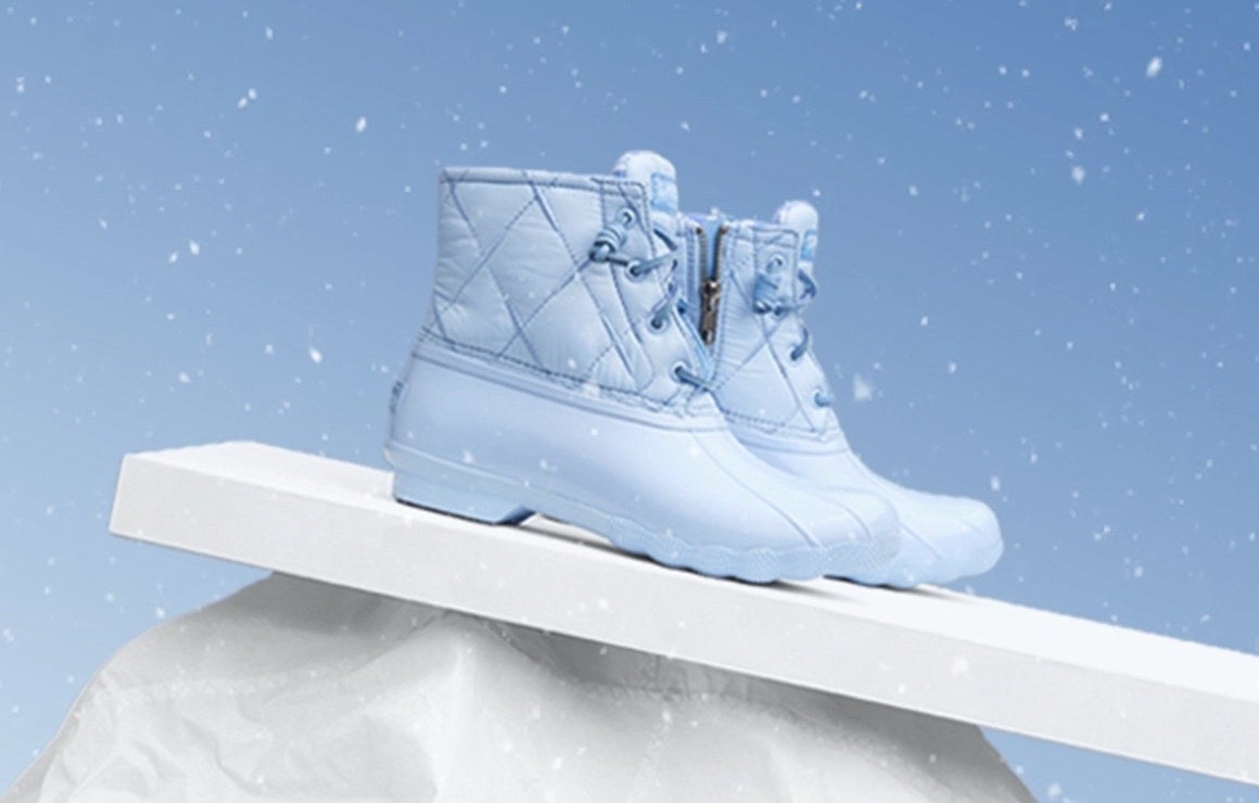 baby blue boots with rubber bottoms and quilted ankles 