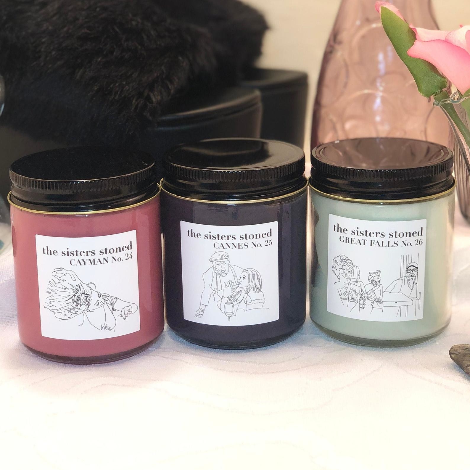 three candles with illustrations of real housewives of potomac moments on then