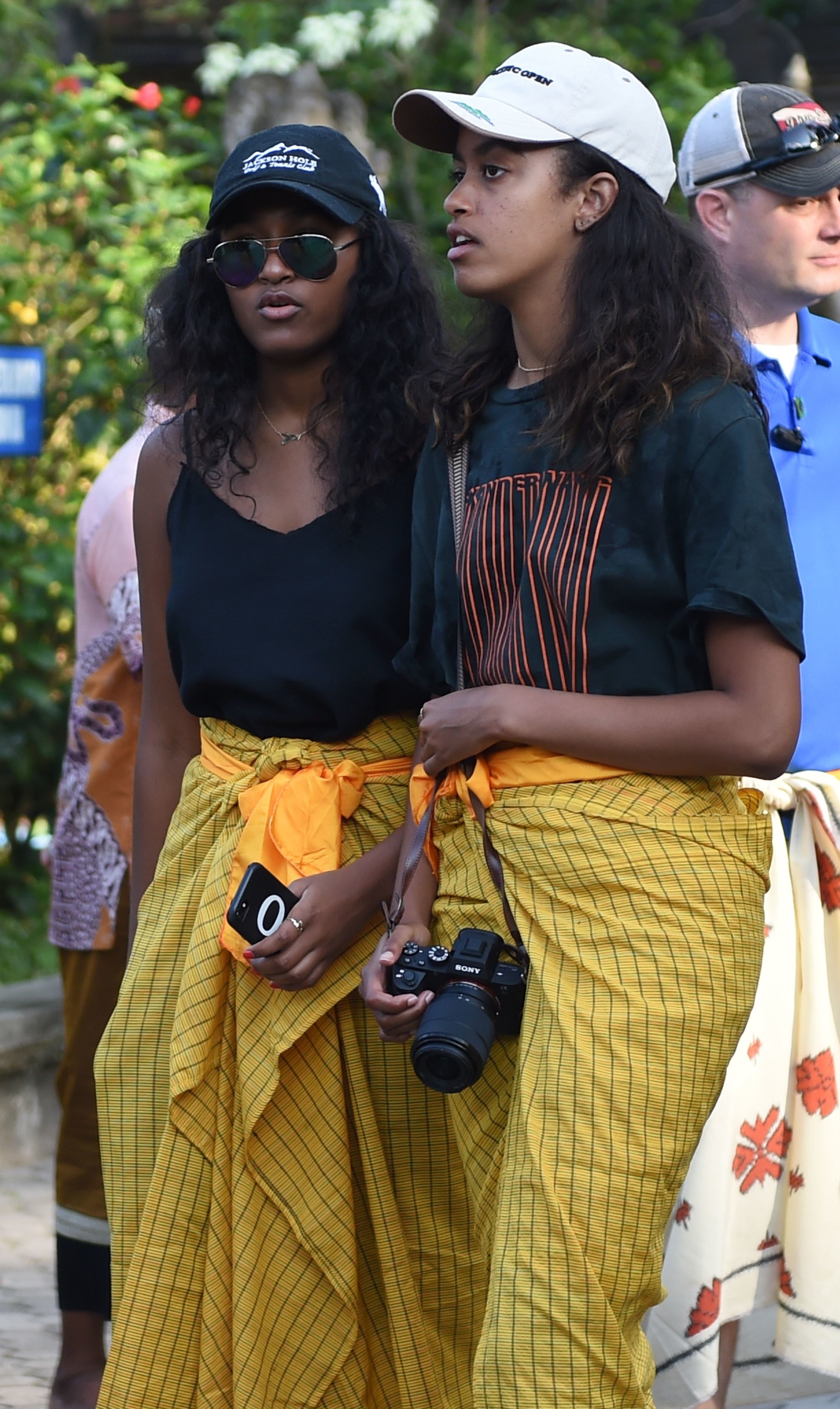 Sasha (L) and Malia (R), daughters of former US president Barack Obama, visit Tirtha Empul temple at Tampaksiring Village in Gianyar on the Indonesian resort island of Bali on June 27, 2017