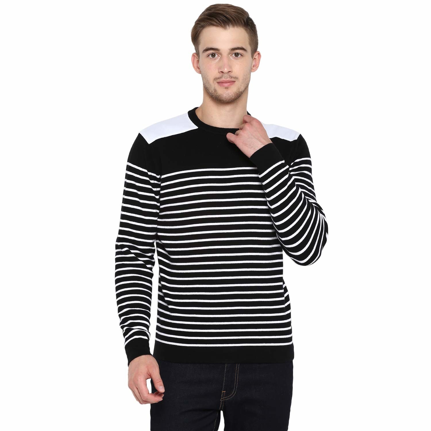 A model wearing a black sweater with white stripes and white patches on the shoulders.
