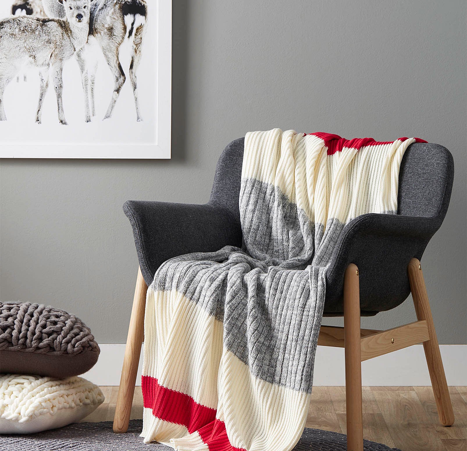 A knit blanket draped over a wooden chair