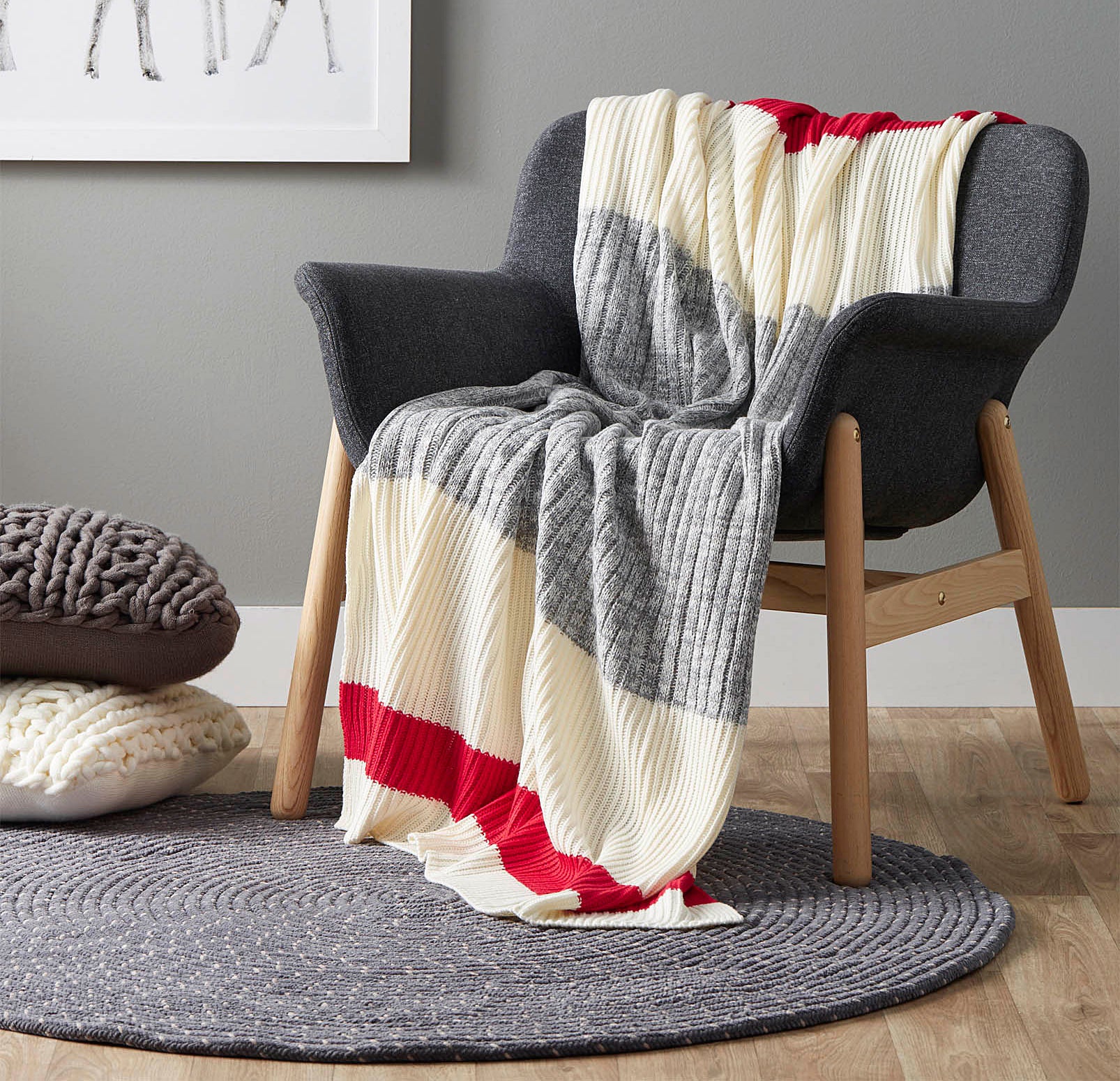 A knit blanket draped over a wooden chair