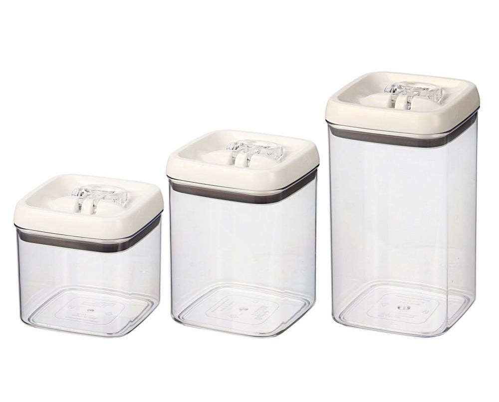 three airtight containers of various sizes with white lids