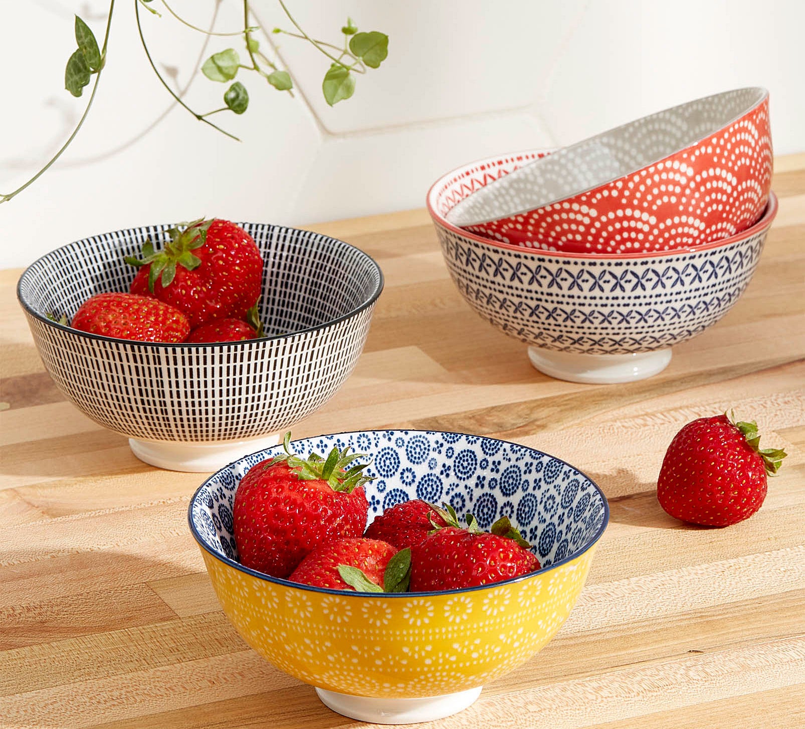 Four fun and fresh patterned bowls with strawberries