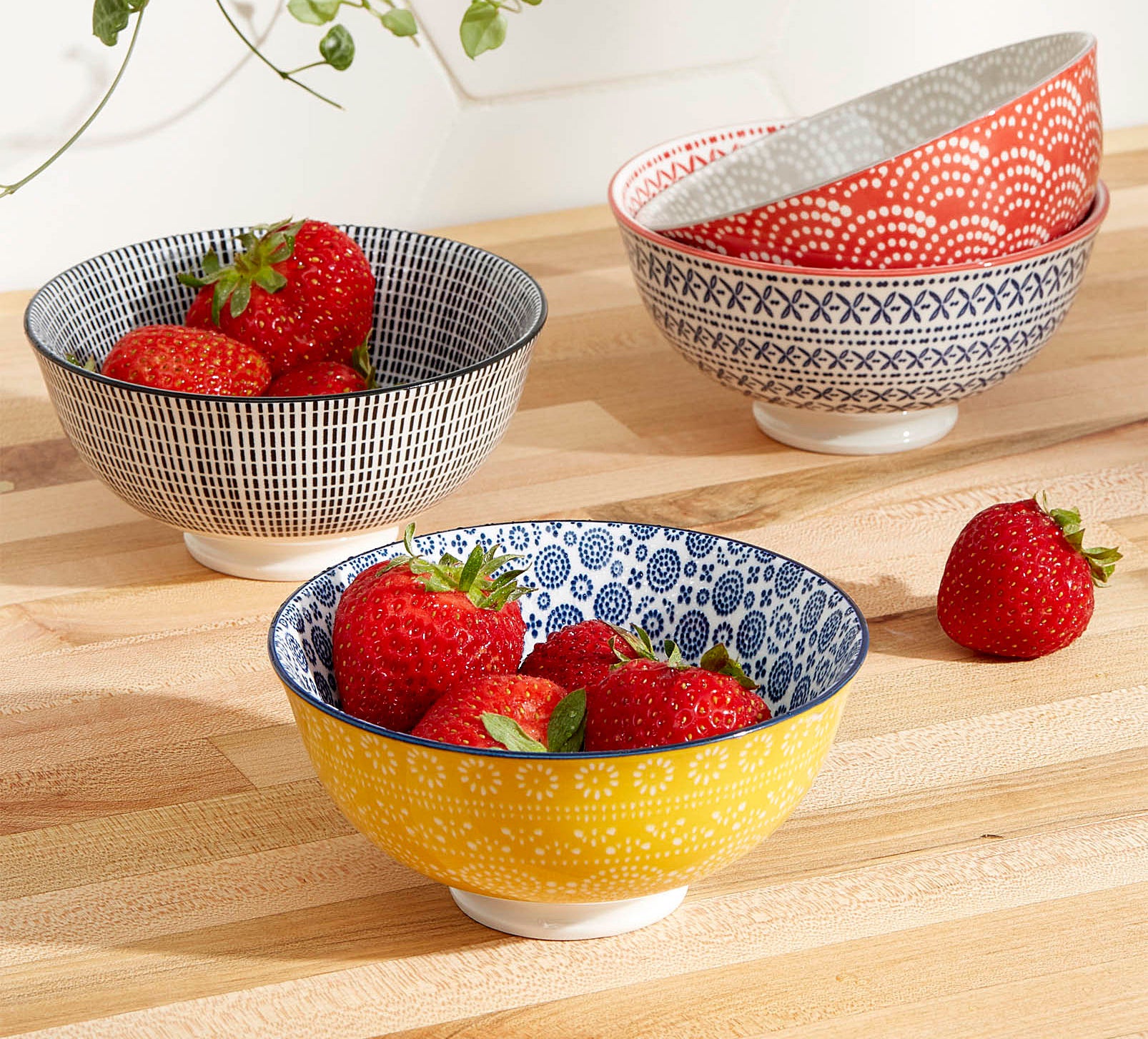 Four fun and fresh patterned bowls with strawberries
