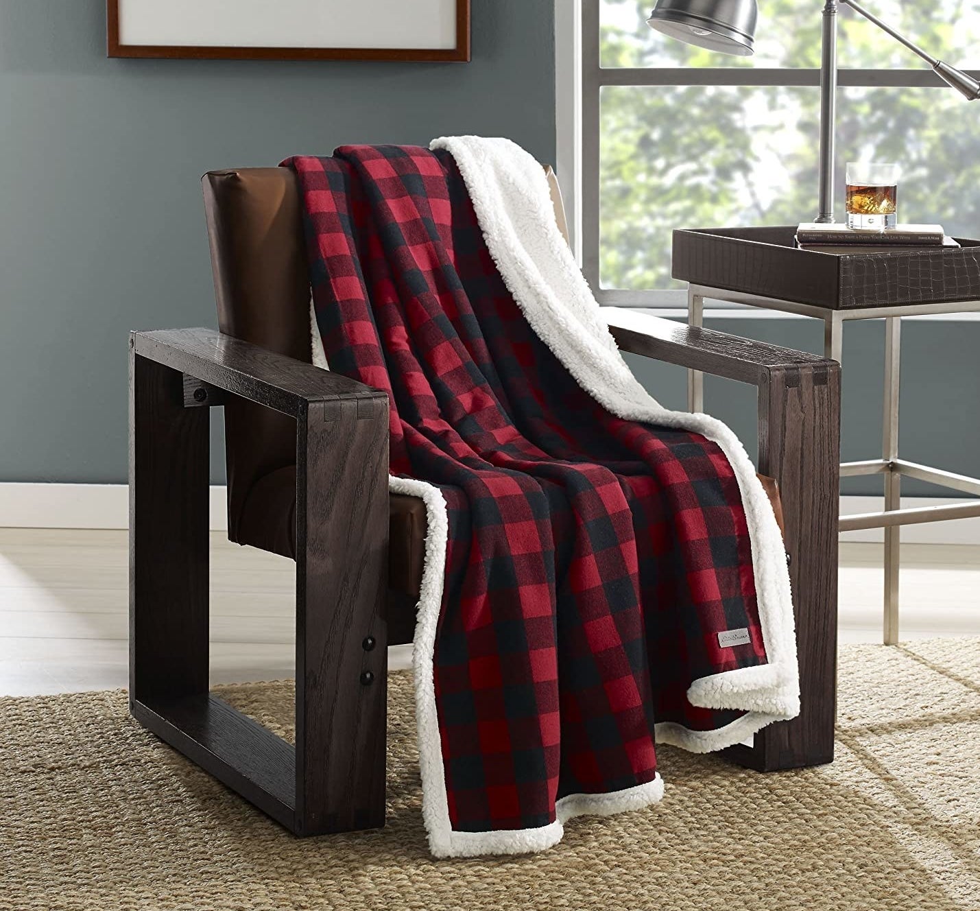 A cozy flannel blanket draping over a big chair