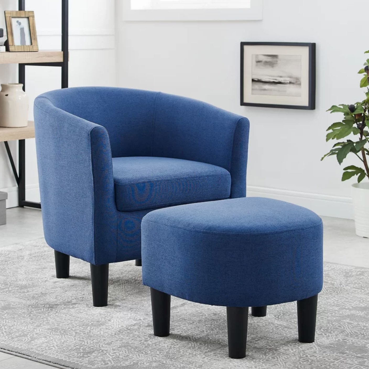 The cloud barrel chair and ottoman in blue