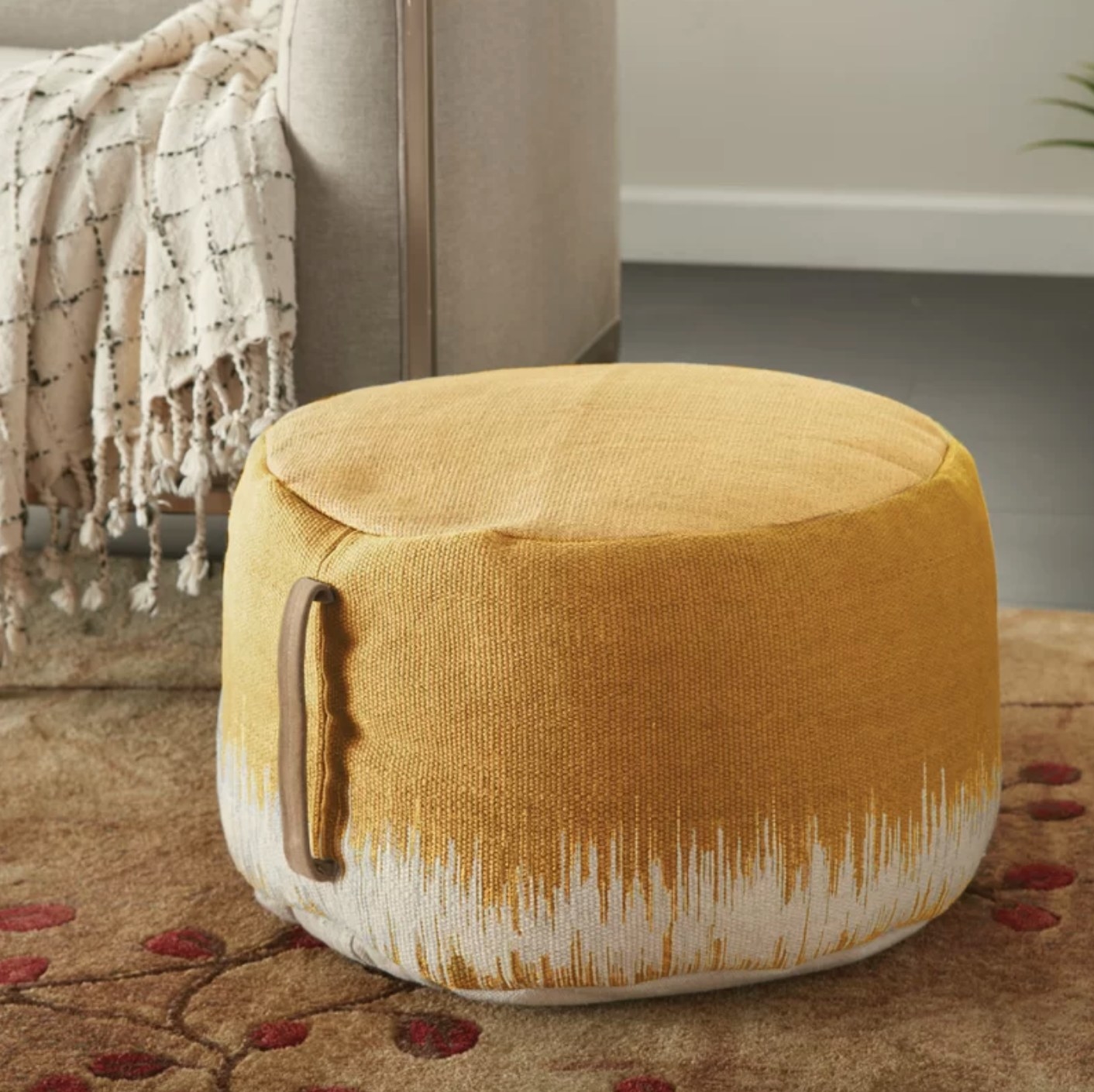 The ottoman pouf in mustard