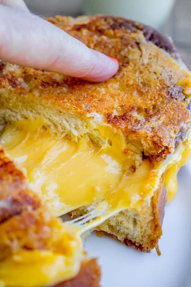 Challah grilled cheese filled with gooey, melted cheese.
