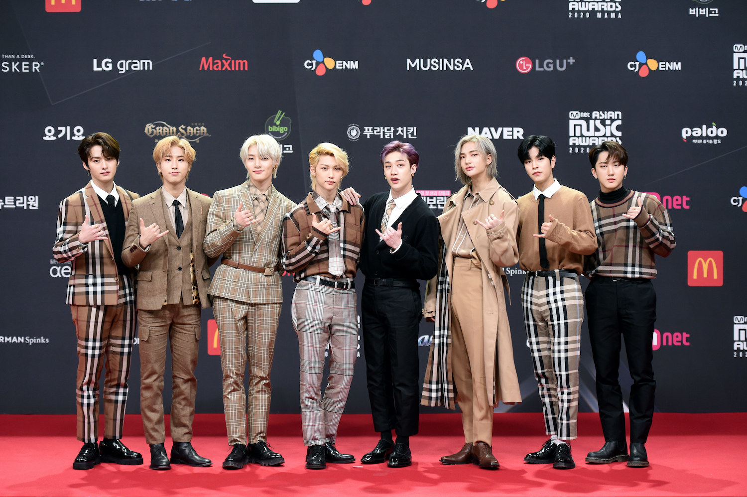 Stray Kids, wearing plaid suits and trench coats, attends the 2020 Mnet Asian Music Awards