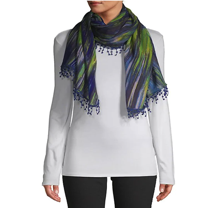 model wearing a blue and green abstract-print scarf