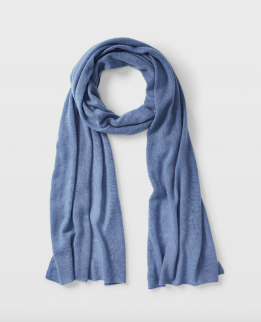A cashmere scarf curled up on a blank background