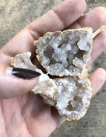 reviewer holding opened geode