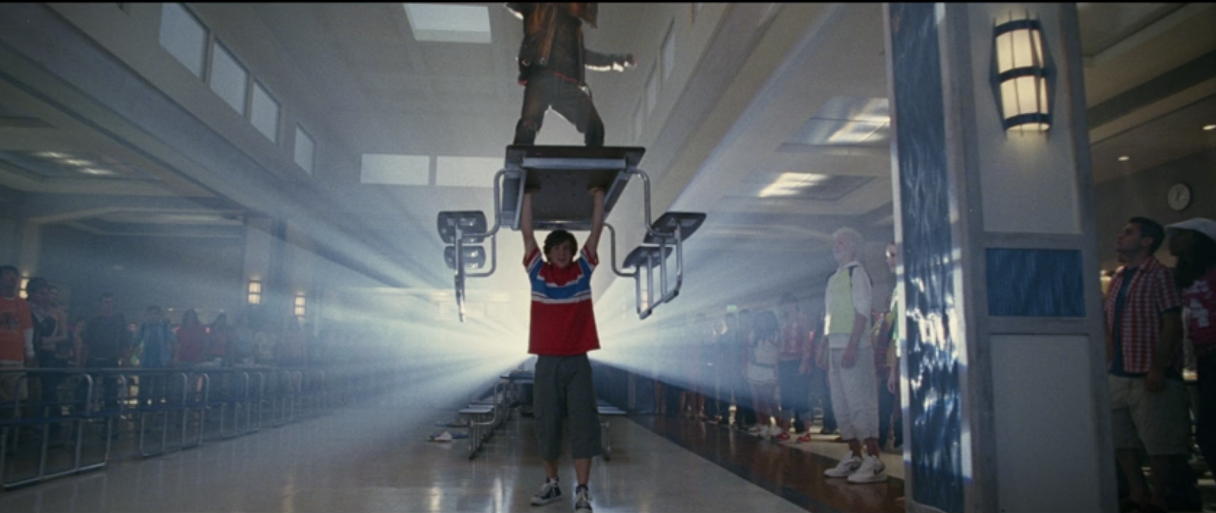 Will holding up a lunch table that Warren is standing on