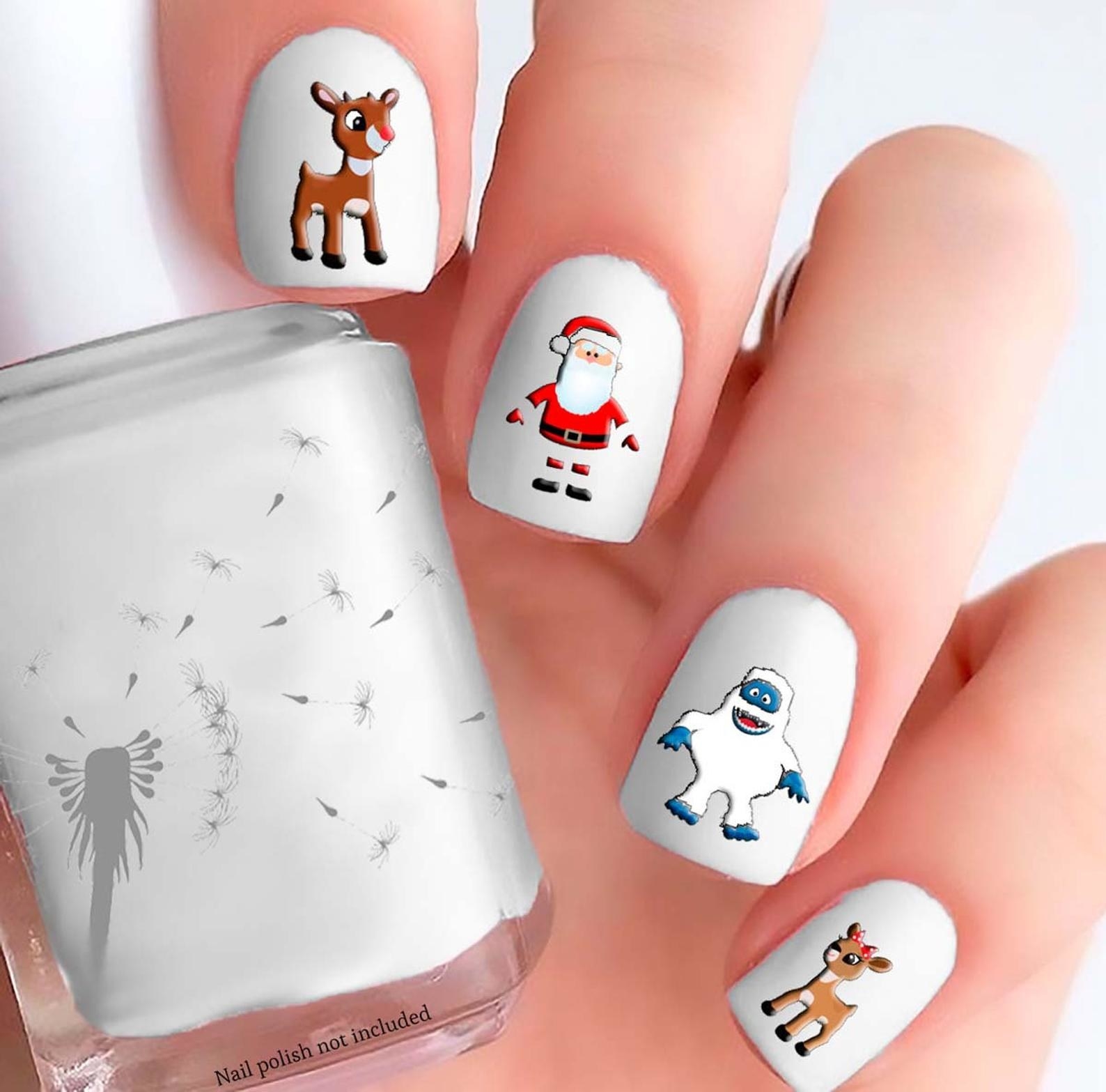 the different characters from rudolph on a model&#x27;s nails